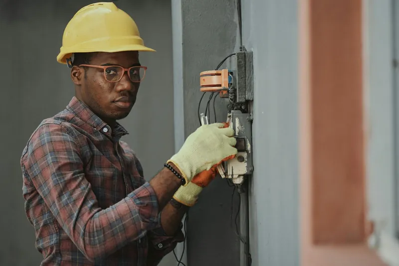Electrician working on an electrical panel
